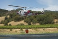 Firefighting California helicopter with water bucket